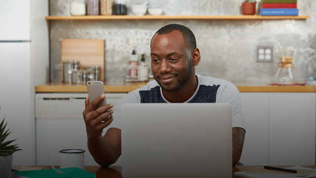 Man receiving prescription notification on his phone