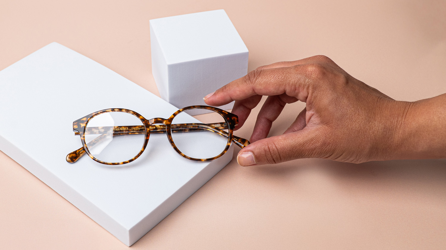 hand reaching for glasses