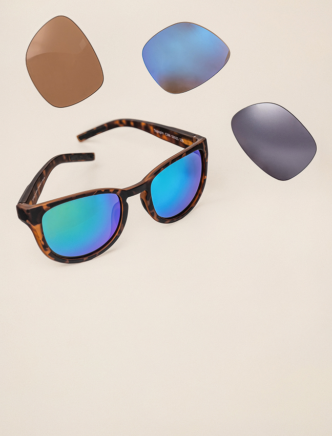 Sunglasses with different color lenses floating around them.