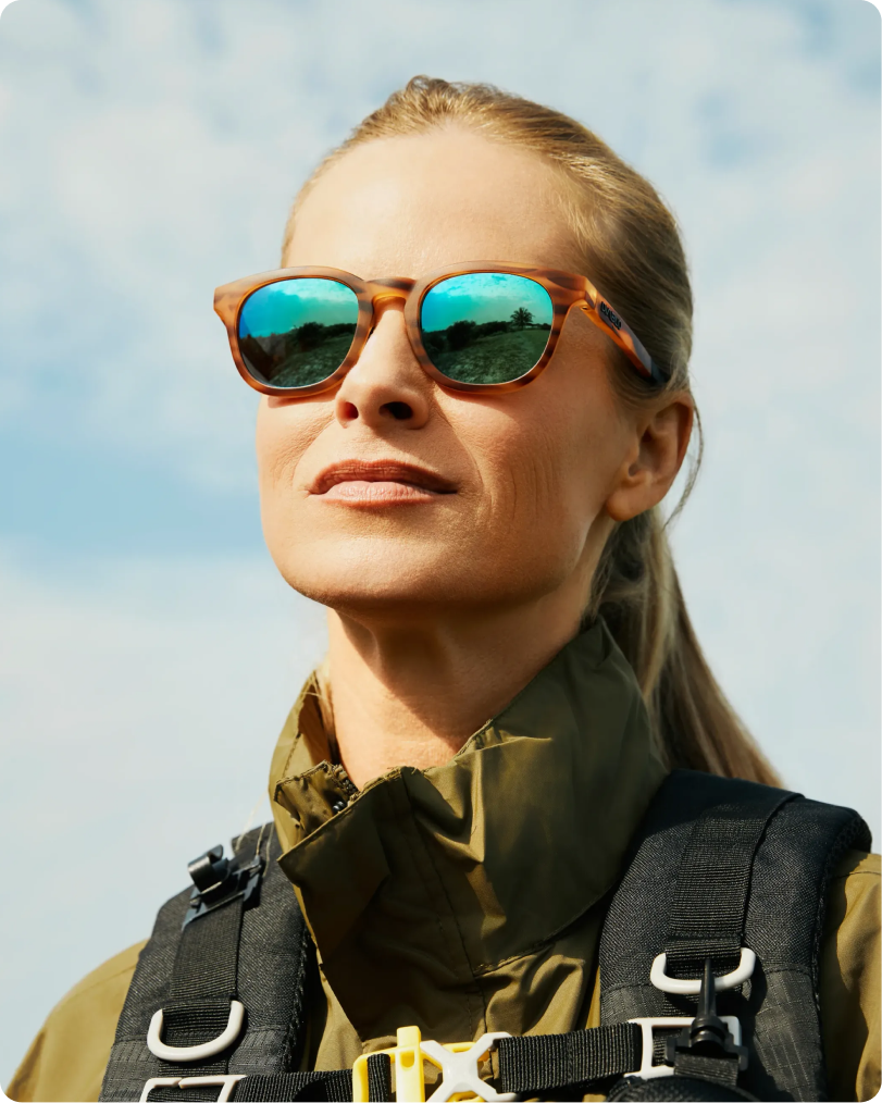 Woman wearing tortoiseshell Diablo sunglasses with blue mirrored lenses