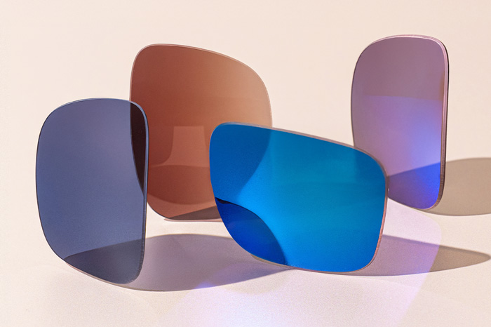 Four sunglass lenses in different colors