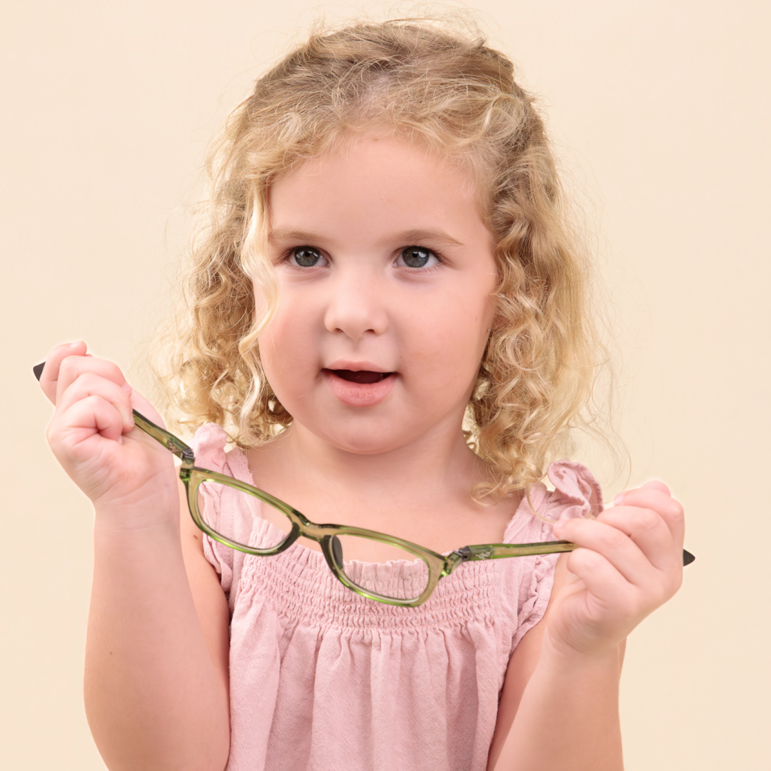 Child bending Lolo's glasses without damaging them