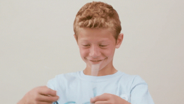 boy holding glasses while bending frames